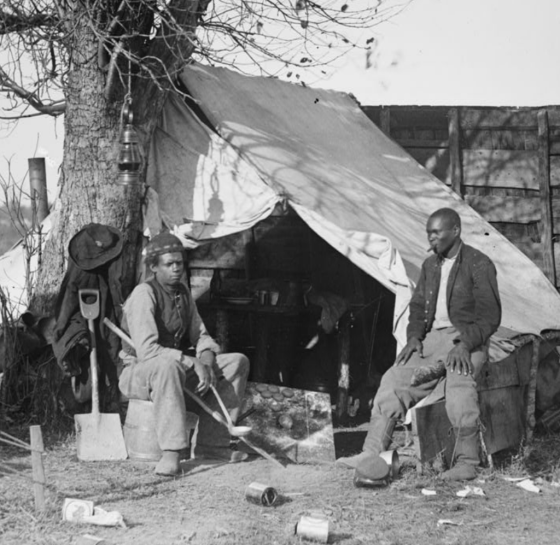 This image depicts two "contrabands"— formerly enslaved African Americans— at Culpeper, VA.
